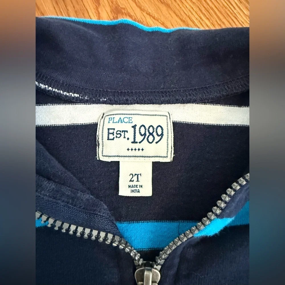The Children's Place quarter-zip pullover in navy, white, and light blue stripes